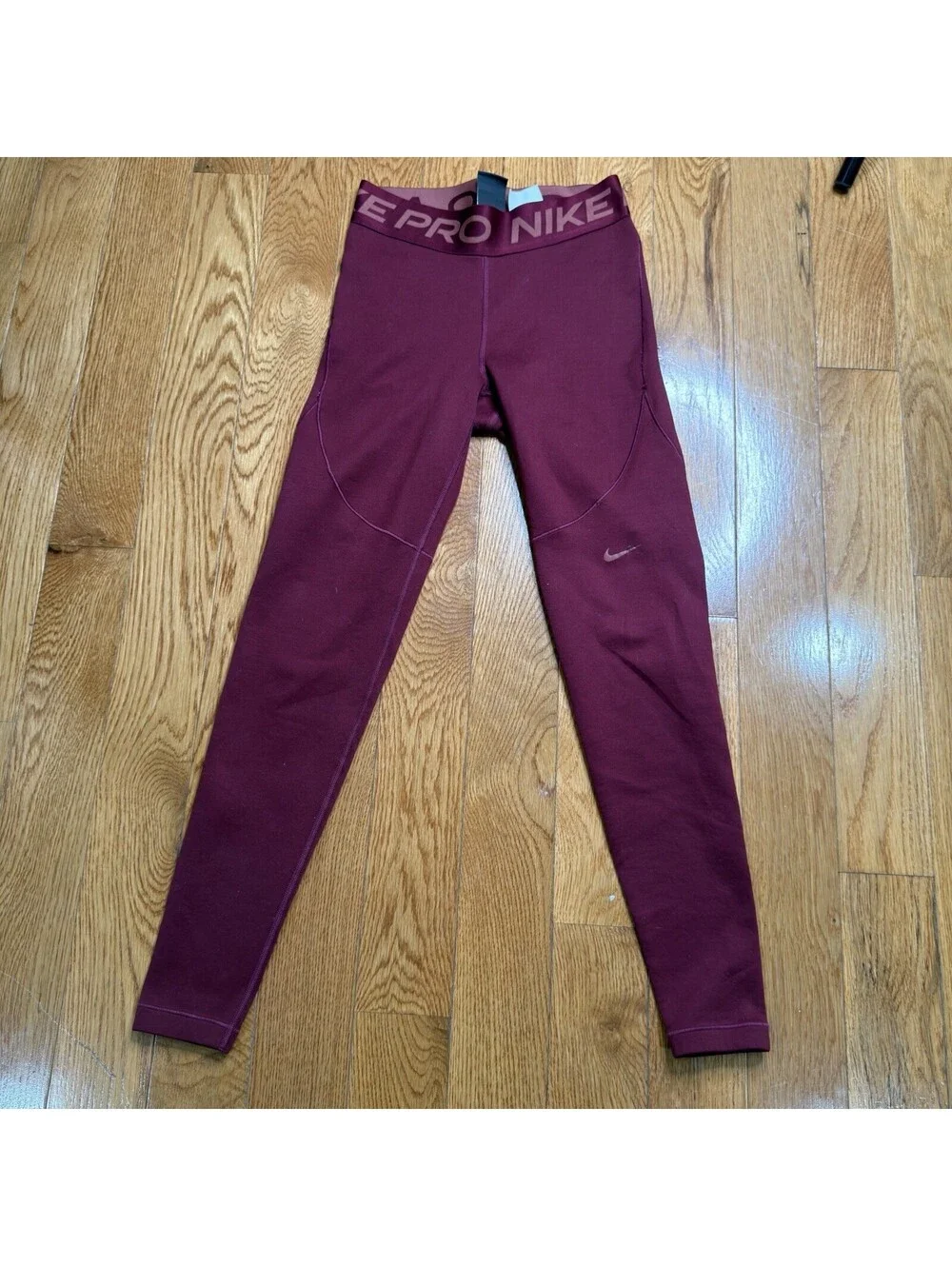 Size Small Women’s Nike Pro Dri-FIT  Burgundy Color.